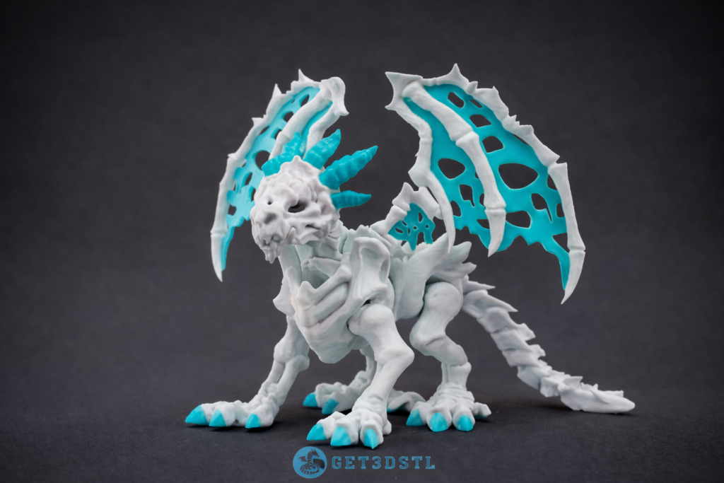 Detailed dragon STL model 3D print with turquoise wings displayed on a dark background